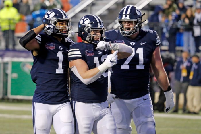 Dec 18, 2021; Shreveport, LA, USA; BYU Cougars wide receiver Keanu Hill (1), tight end Masen Wake (13), and offensive linemen Blake Freeland (71) react after a big gain to the one yard line to setup a touchdown during the fourth quarter against the UAB Blazers during the 2021 Independence Bowl at Independence Stadium. Mandatory Credit: Petre Thomas-USA TODAY Sports